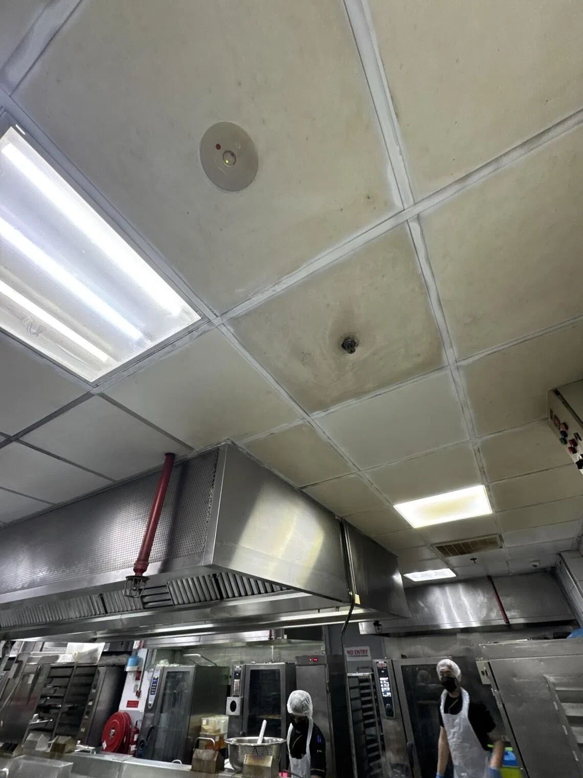 Food safety lapses found during SFA’s inspection of Stamford Catering’s premises included dirty ceiling boards at the kitchen area. - Photo: SINGAPORE FOOD AGENCY
