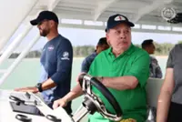 King pilots speedboat to inspect waters around Mersing