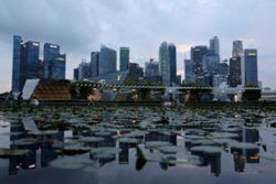 Singapore urges financial firms to use AI to create better jobs