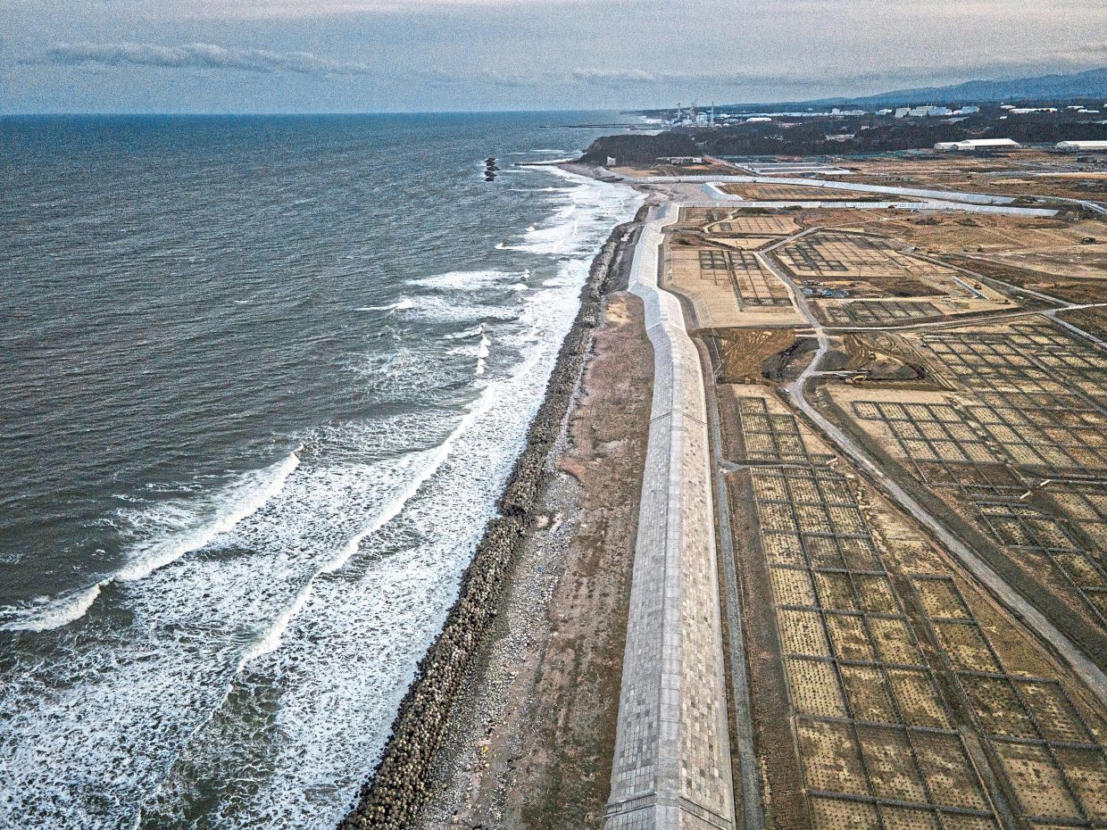 A file photo showing a massive sea wall in Fukushima Prefecture, part of a coastal defence system built to protect against tsunamis, like the one in 2011 that sparked a meltdown at a nuclear plant. — James Whitlow Delano/The New York Times