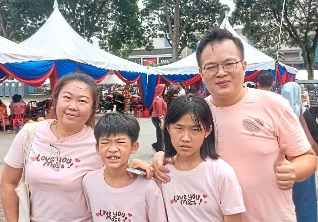 Ng (left) and family learned about safety and emergency response at the carnival.