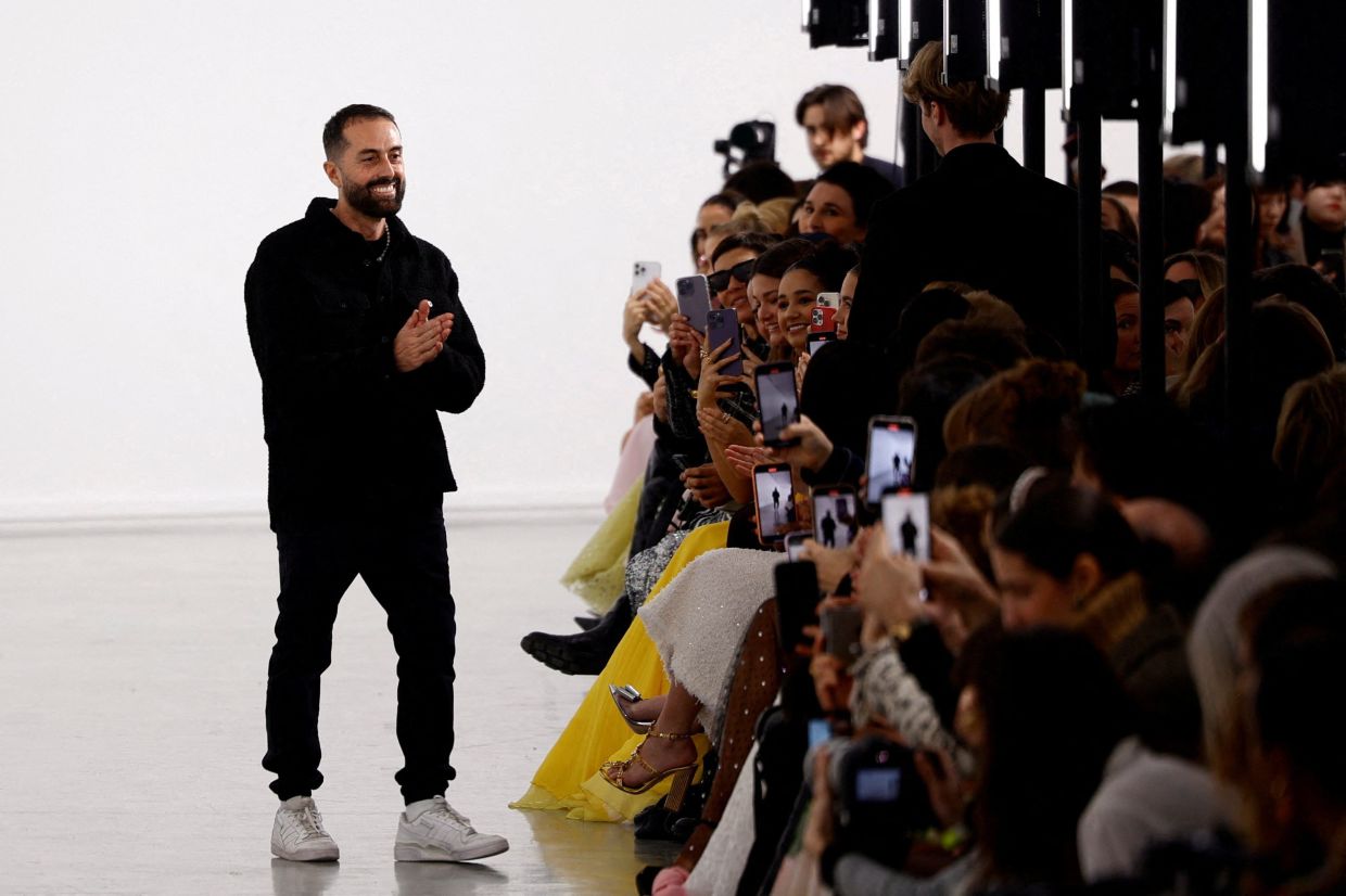 Designer Giambattista Valli appears at the end of his Autumn/Winter 2023 women's ready-to-wear collection show during Paris Fashion Week. Photo: Reuters