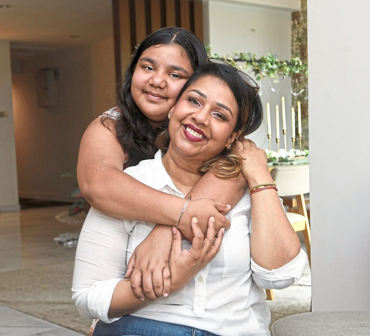 Dr Dakshinah (front) and her daughter Theeya often spend time together on their crafting projects.