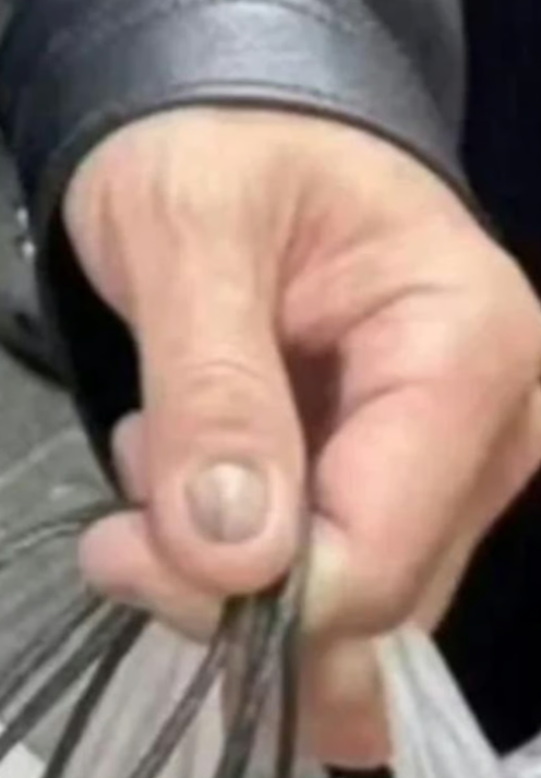 Eagle-eyed internet users speculated on the reason for Huang’s discoloured fingernail, above. -Threads