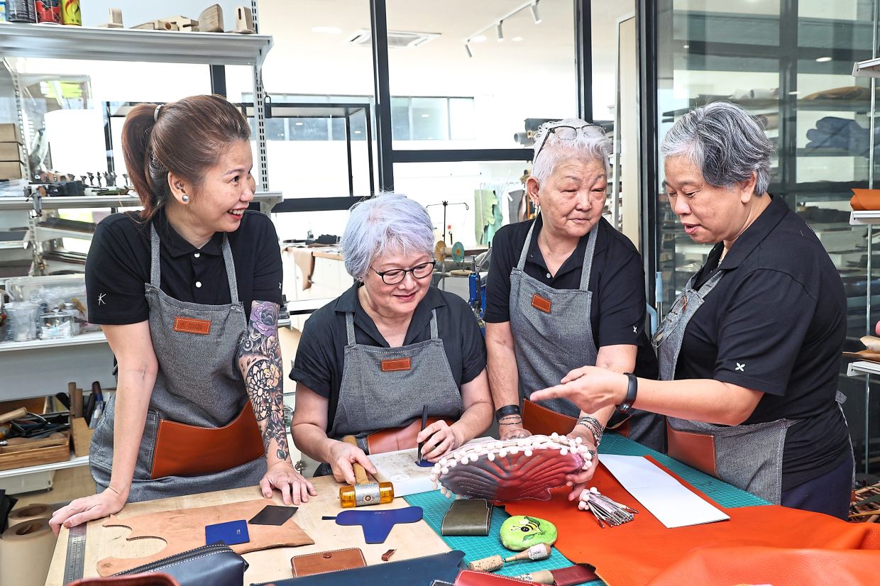 (From left) Hue, Hoh, Liang and Teo are four friends who found camaraderie and a way to destress through leather crafting.