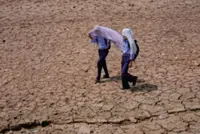 Heat wave empties roads and markets in north India as some farmers turn to nighttime work