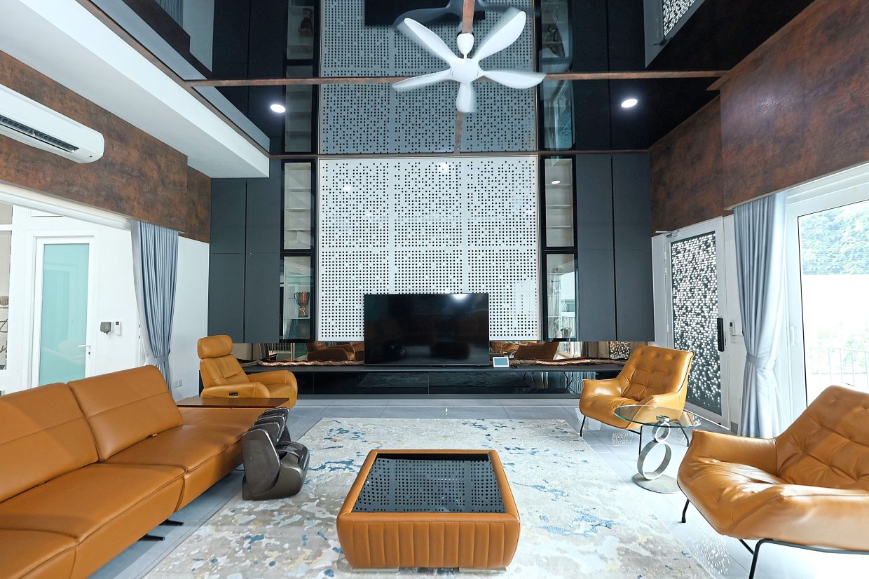 Laser-cut metals in white provide a 'wow factor', transforming the guest TV area into acentral decorative element.