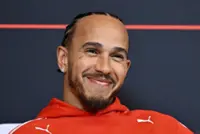 Motor racing-Hamilton sheds tear over Arsenal title as drivers swap lap times for football talk