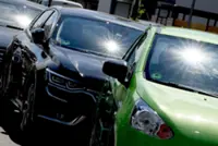 What do you do if you see a child or animal in a hot car?