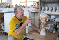 Orders pile up for a Brazilian artisan’s replica World Cup trophies