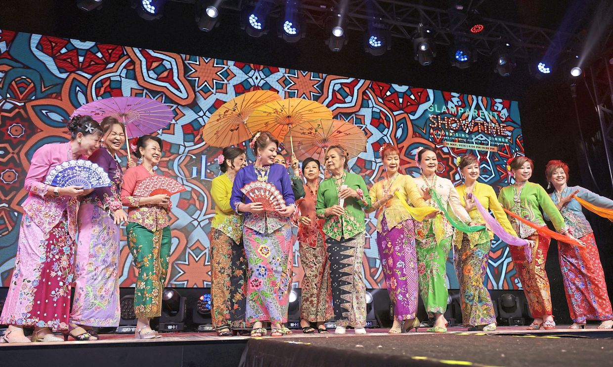 The Glammas all dressed in colourful nyonya kebaya while performing the inang dance.