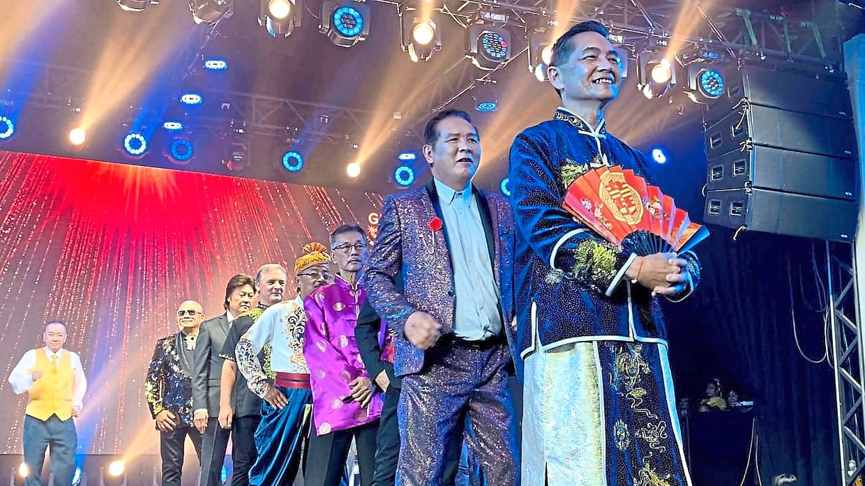 Glamparents participants enjoying their moment under the spotlight. — Courtesy of BARRY KHOO (Right) Henry Goh and partner Jajanet working the runway during the fashion show.