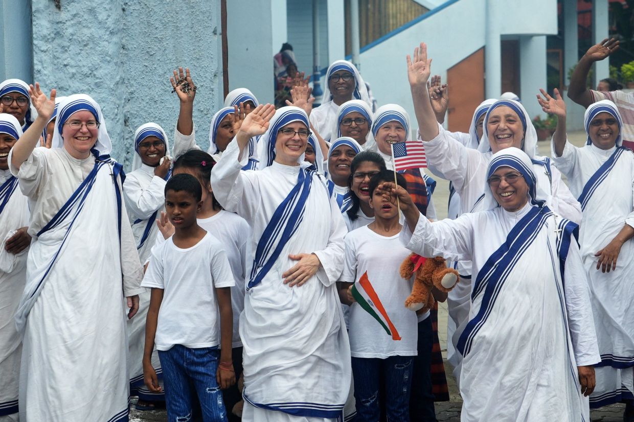 Sisters of Nirmala Shishu Bhavan children’s home of the Missionaries of Charity waving at the cavalcade of US Secretary of State Marco Rubio during his visit in Kolkata on May 23. - Reuters