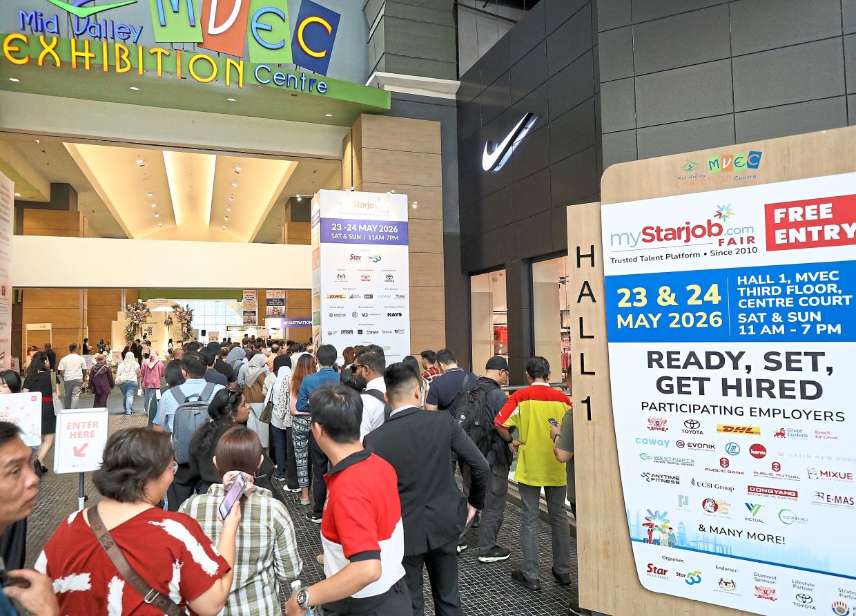 Career hunt: Participants entering the venue to seek out job opportunities. — AZLINA ABDULLAH/The Star