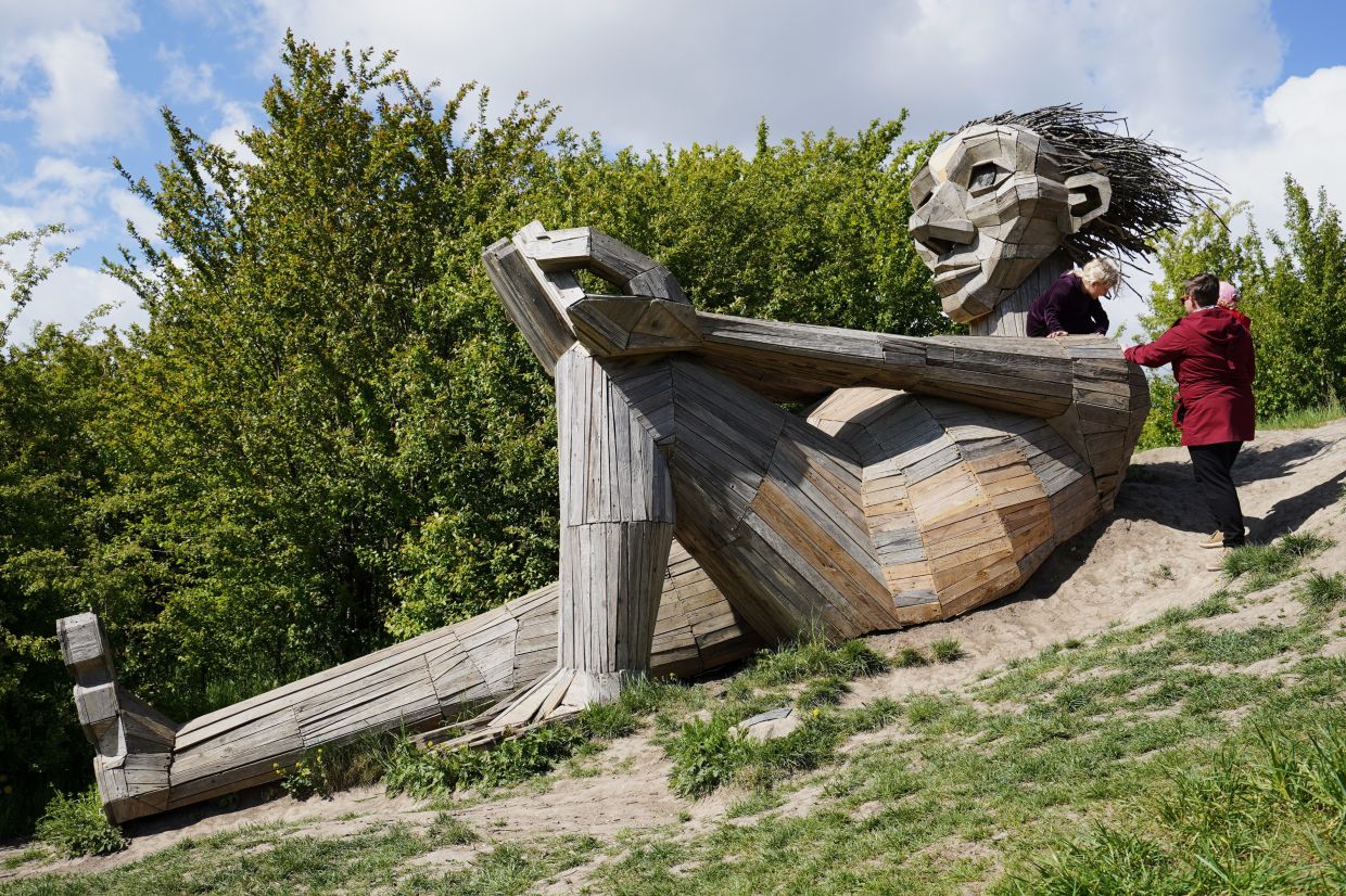 Dambo’s work is part exhibit, part treasure hunt, with his fairy-tale creations hidden in forests, mountains, jungles and grasslands worldwide, discoverable via an online 'Troll Map.' Photo: AP