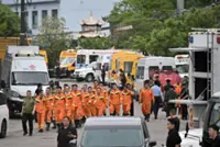 China revises death toll from mine accident to 82 from 90