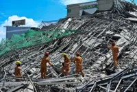Two trapped people alive after Philippines building collapse, rescue continues