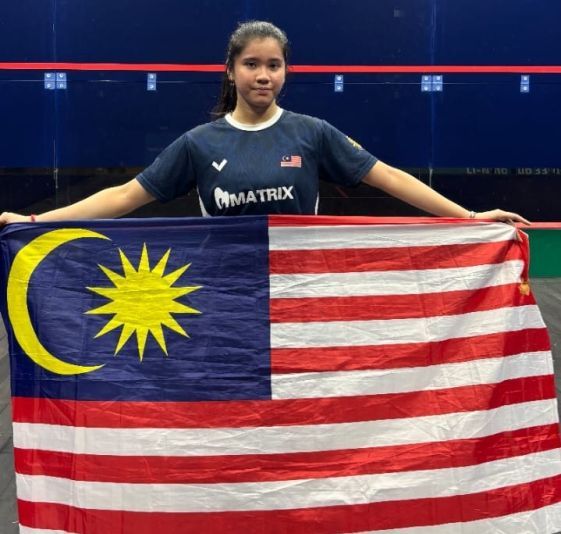 Proud day: Harleein Tan posing with the Jalur Gemilang after her win.