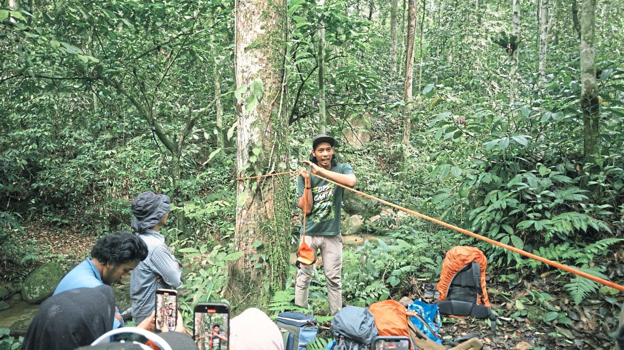 Abdul Rahman (middle) who has been camping for more than 10 years, is a mountain guide. Redzuan goes camping at least once in three months. — REDZUAN HAZIQ MOHAMAD KHIR