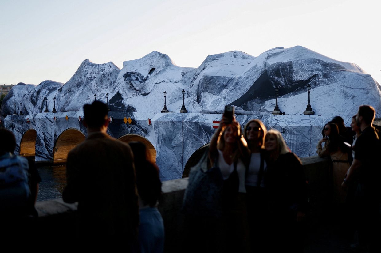 JR, one of the best known figures on the French art scene, created the new work as a tribute to the duo Christo and Jeanne-Claude. Photo: Reuters 