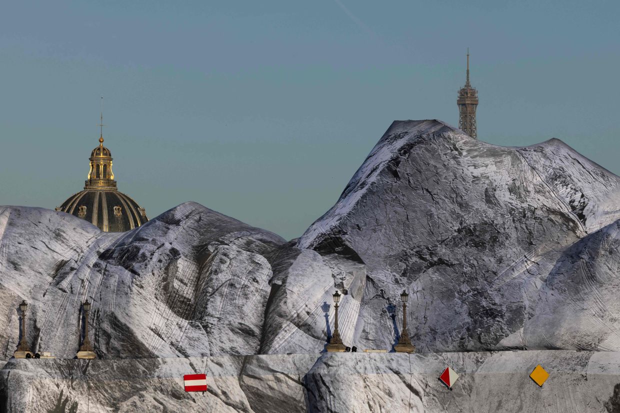 JR's work, titled 'La Caverne' (The Cave) in French, is the latest in a series of large-scale public art pieces to grace Paris. Photo: AFP 