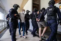 11 men charged with being members of organised crime group