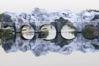 'French Banksy' and Daft Punk star turn Paris bridge into Alpine cave