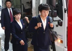 Stony-faced North Korean women’s team leaves South Korea after title win