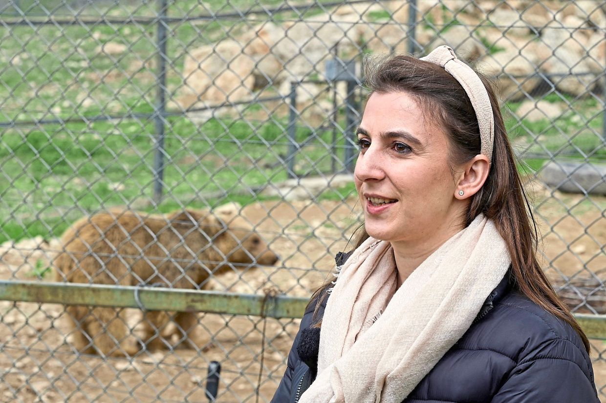 Hovhannisyan talking to reporters by an enclosure at the foundation. — AFP