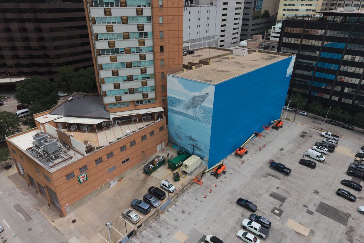Wyland has painted over 100 similar murals known as Whaling Walls around the world as part his mission for the conservation of ocean life. Photo: AP