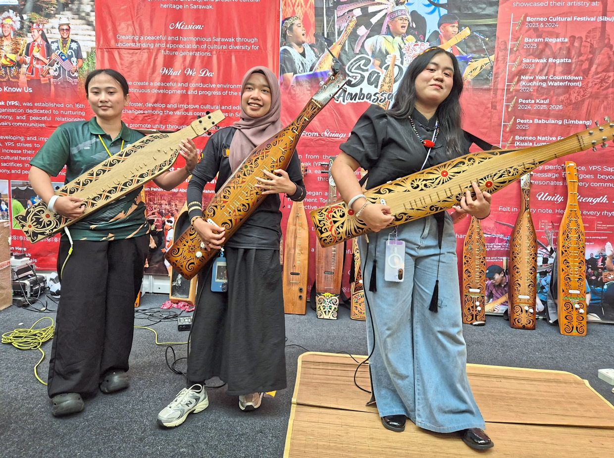 From left: Gloria, Qaseh Ilyani Batrisya Muhamad and Annette Ixora Shea Anak Saptemba are among a growing number of women embracing the sape. Photo: The Star/Sheela Chandran