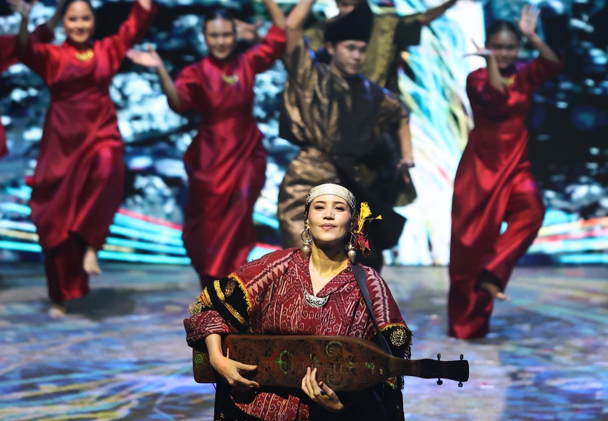 Alena performing the sape during the 47th ASEAN Summit and Related Summits opening ceremony in Kuala Lumpur last year. The Star/Azman Ghani