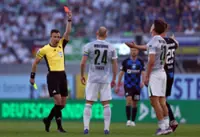 Soccer-10-man Wolfsburg relegated from Bundesliga after extra-time playoff loss to Paderborn