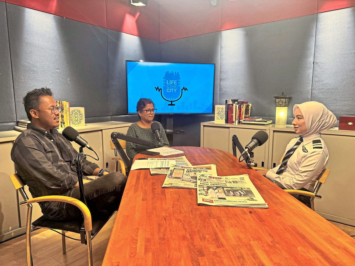 (From left) Farid, Aida with Farah chatting about her journey to becoming a commercial pilot.