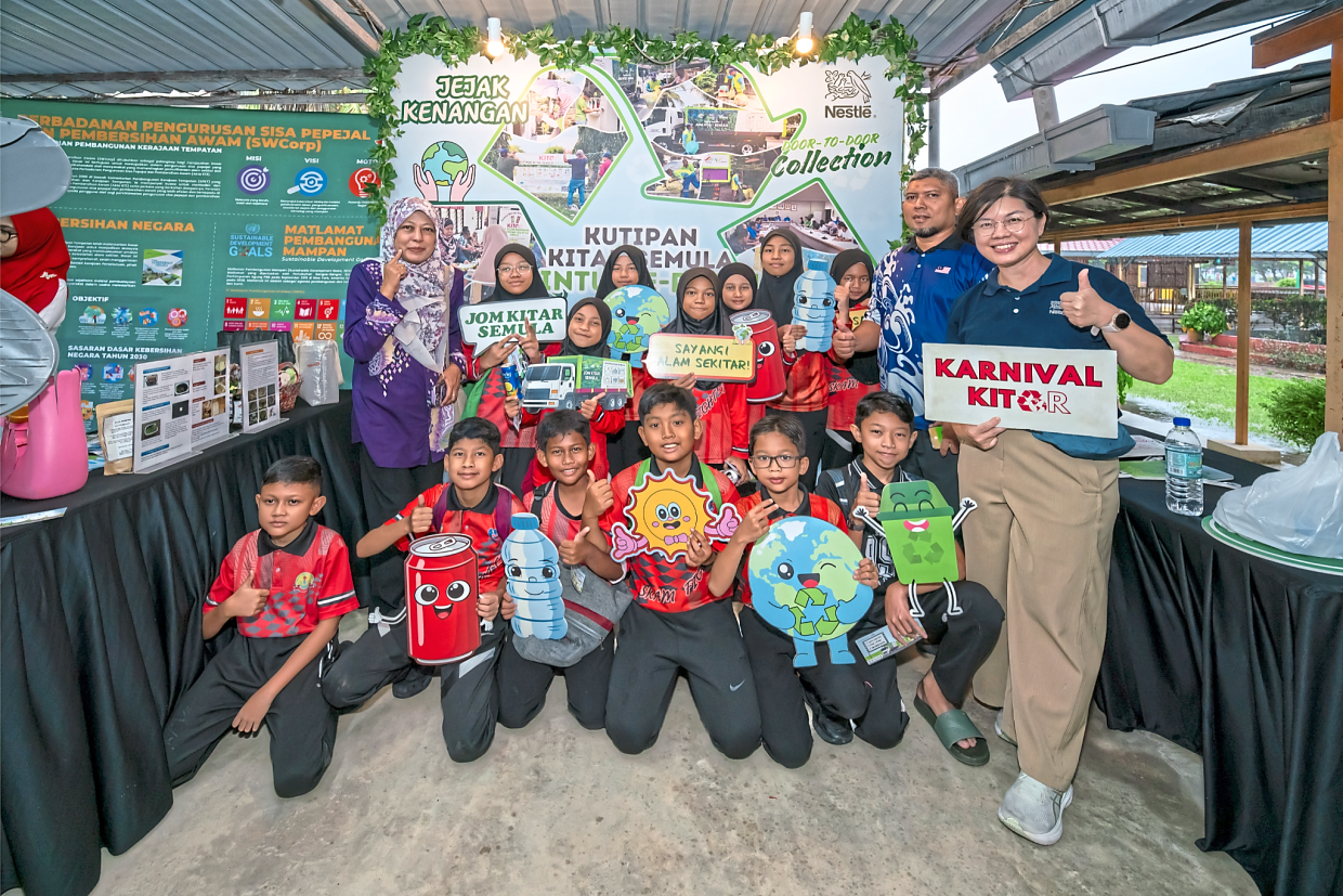 SK Ayer Merah pupils learning about recycling under Project SAVE at the event in Kulim, Kedah. — Handouts