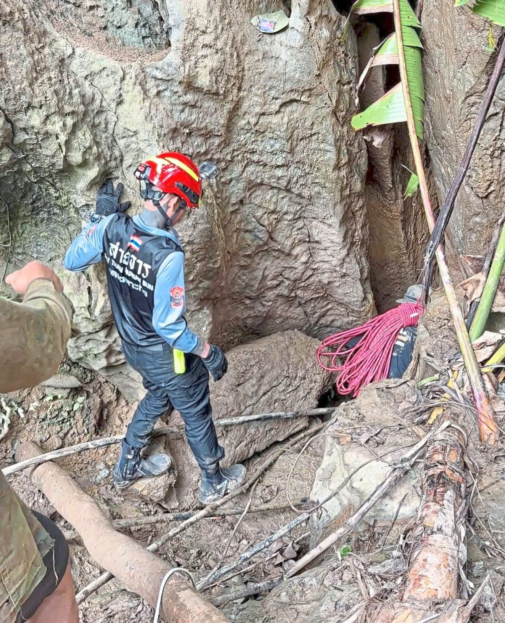 Getting closer: Rescuers carrying out a search operation for the seven people trapped in a cave in Xaisomboun province. — AP