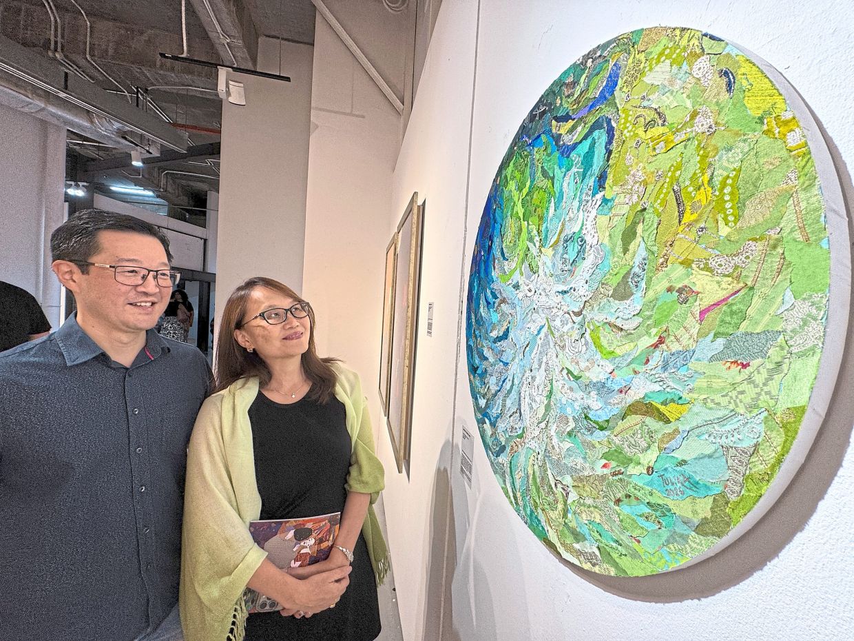 Gallery visitors admiring one of the pieces from ‘The Birth of A Star’ series.
