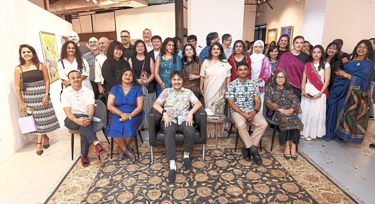 Tunku Ali Redhauddin (seated centre) at the official opening of ‘I Am the Universe’. With him are (seated from left) Prashant, Tulika, Prateesh and Maizon.