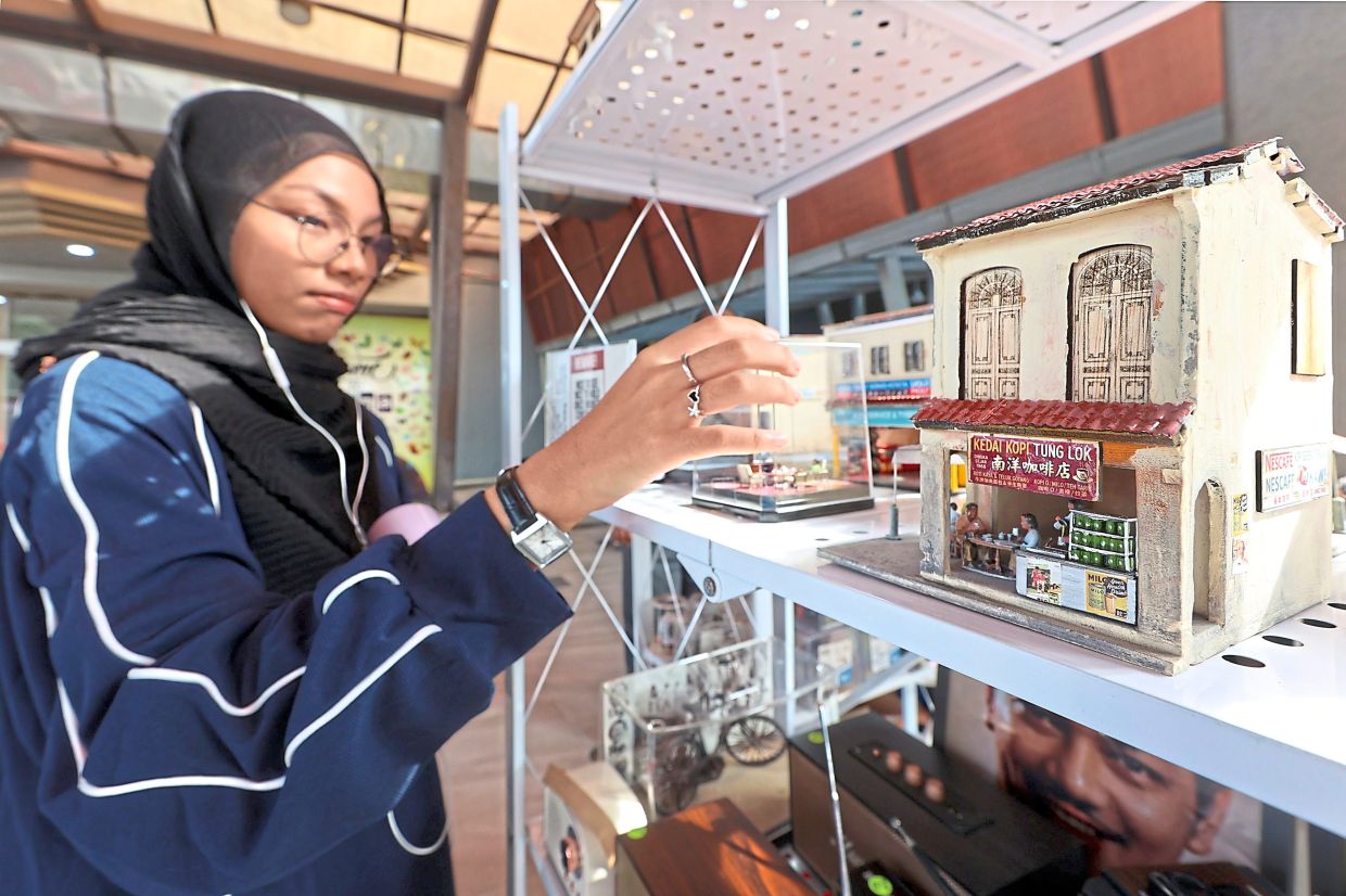 A stall selling miniature buildings at the morning market in Johor Baru.