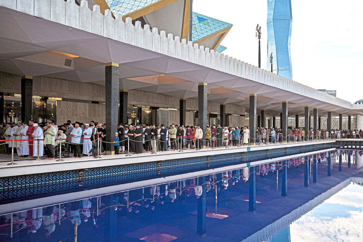 Mark of devotion: Muslims performing the Aidiladha prayers at the National Mosque. — Bernama