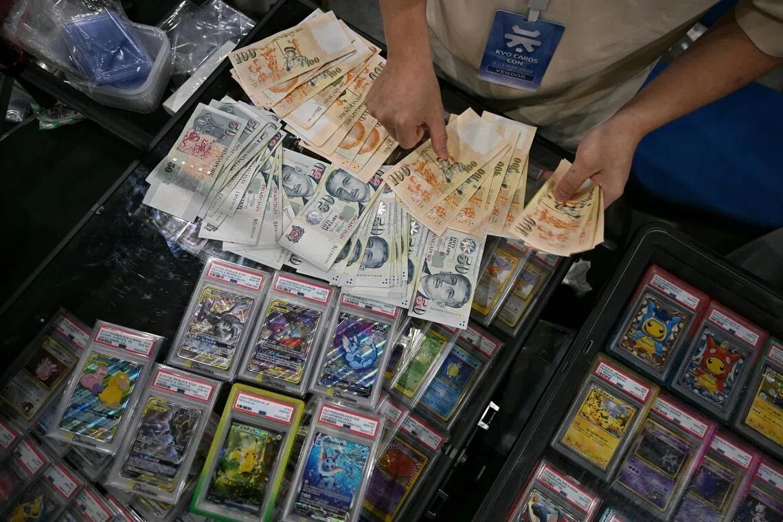 Thick wads of cash changed hands in the open at Kyo Cards Con on May 2. - Photo: ST