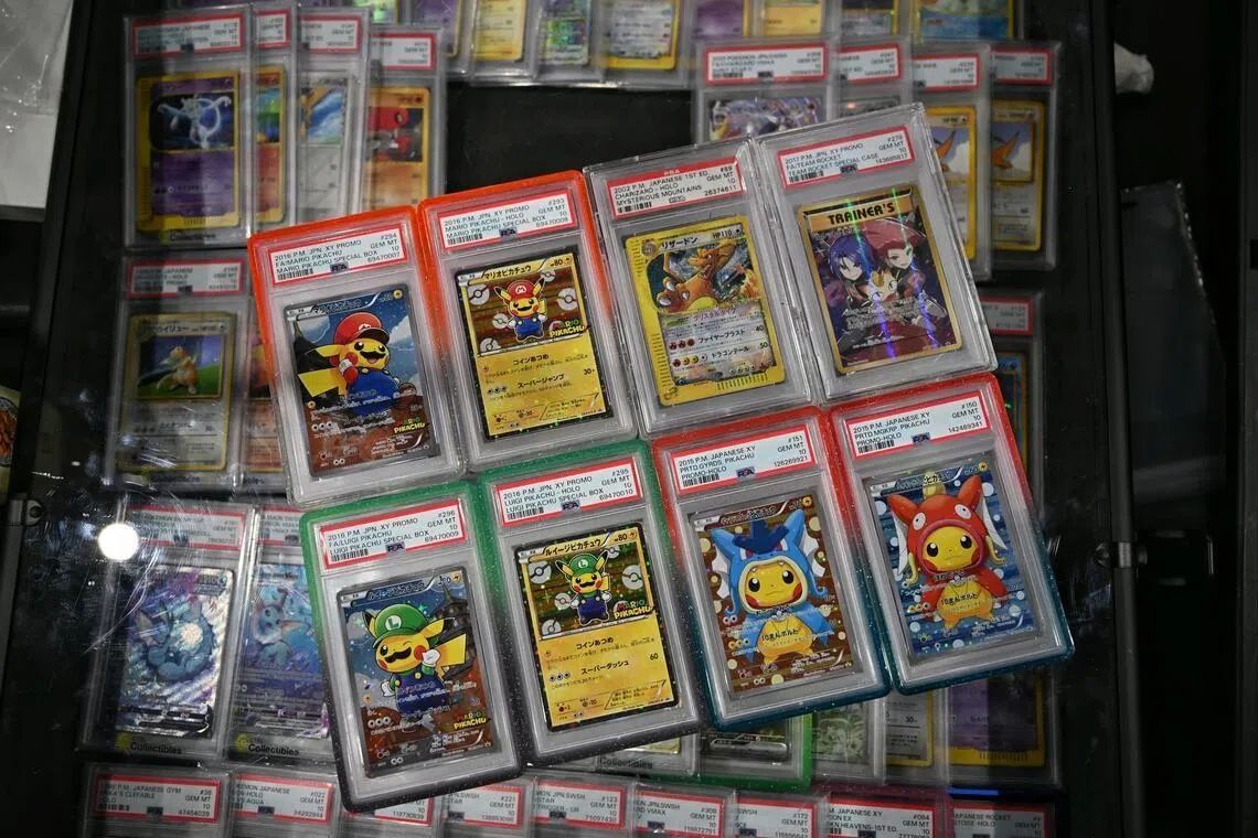 Polymon, one of the larger vendors at Kyo Cards Con, displayed a set of eight cards featuring Mario Pikachu and Poncho-Wearing Pikachu valued at about S$240,000 based on recent online sale data. - Photo: ST