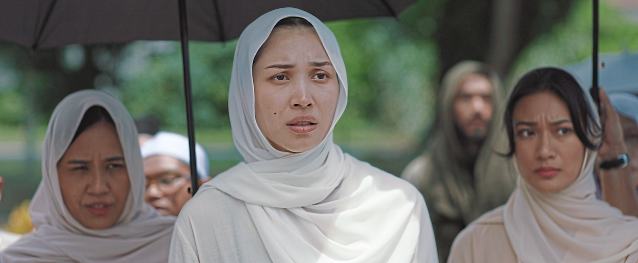 Zahirah Macwilson (centre) has to dig deep to portray a grieving mother in 'Good Boys Go To Heaven'. Photo: Handout