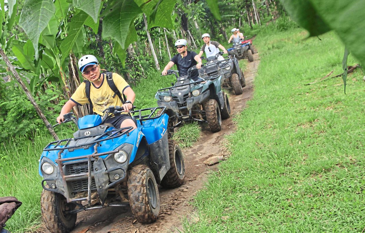 (from left) Tan, Saw, the writer and Shee seeking adventure in Bali.