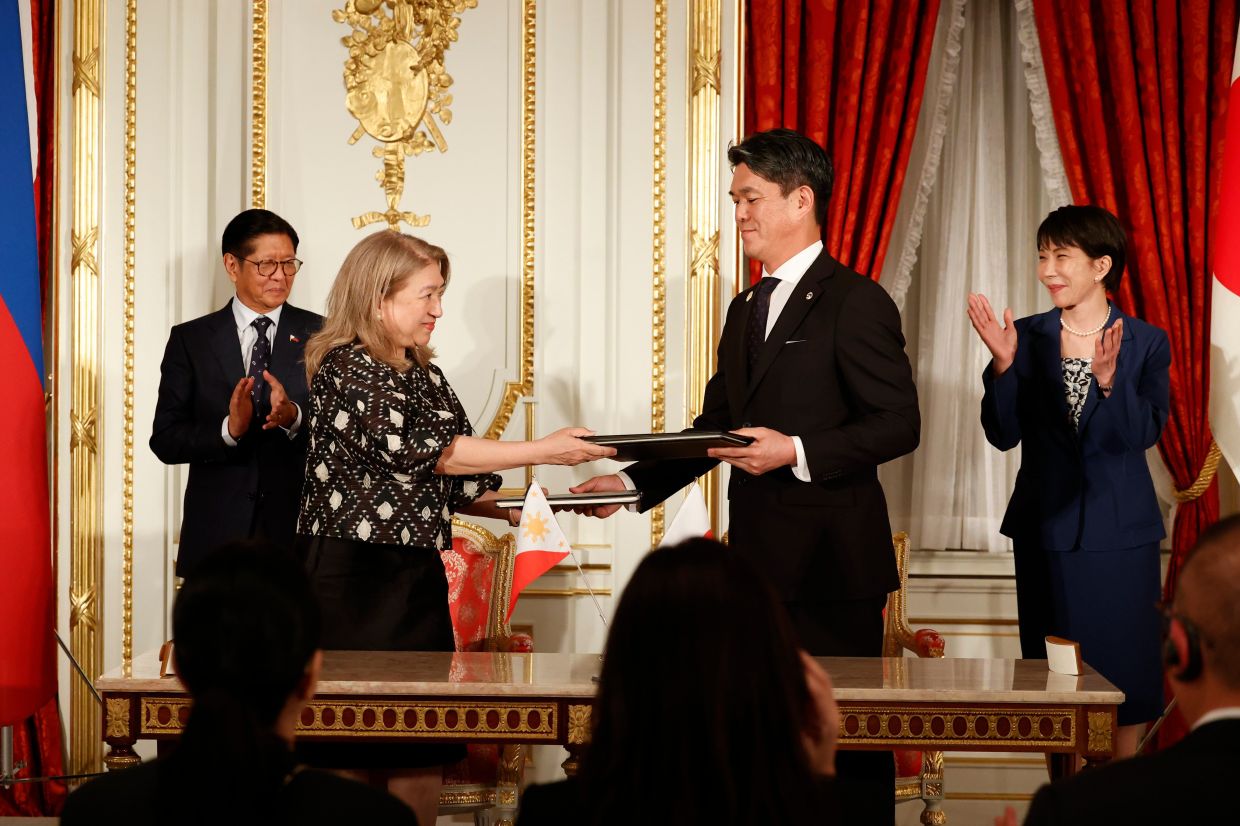 Philippine President Ferdinand Marcos Jr (from left), Mylene J. Garcia-Albano, Ambassador of the Philippines to Japan, Kazuya Endo, Ambassador of Japan to the Philippines, and Japanese Prime Minister Sanae Takaichi exchange documents during the Cooperation Document Exchange Ceremony at the Akasaka Palace State Guest House, on Thursday, May 28, 2026, in Tokyo, Japan. -- Rodrigo Reyes Marin/Pool Photo via AP