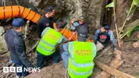 Rescuers race to drain flooded Laos cave, extract trapped men