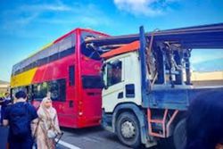 Thirteen dead after overloaded bus rear-ends truck in central China
