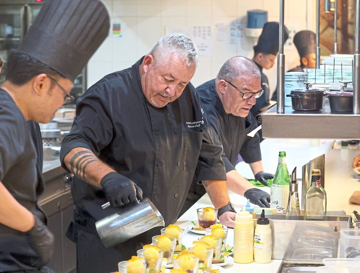 Rodriguez (centre) plating up one of courses during the wine-pairing dinner.