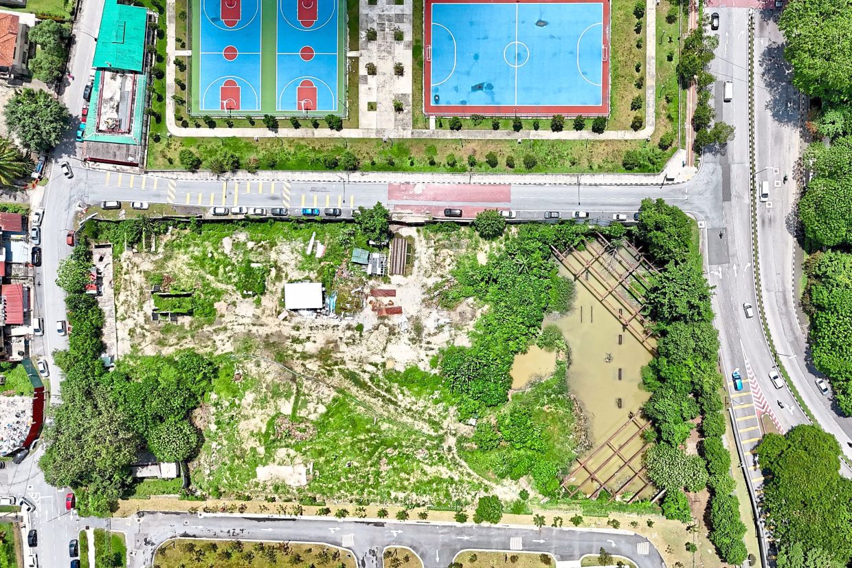 An aerial view of the abandoned and waterlogged site along Jalan Tun Sambanthan 2 in Brickfields, beside DBKL’s sports facilities and football field.