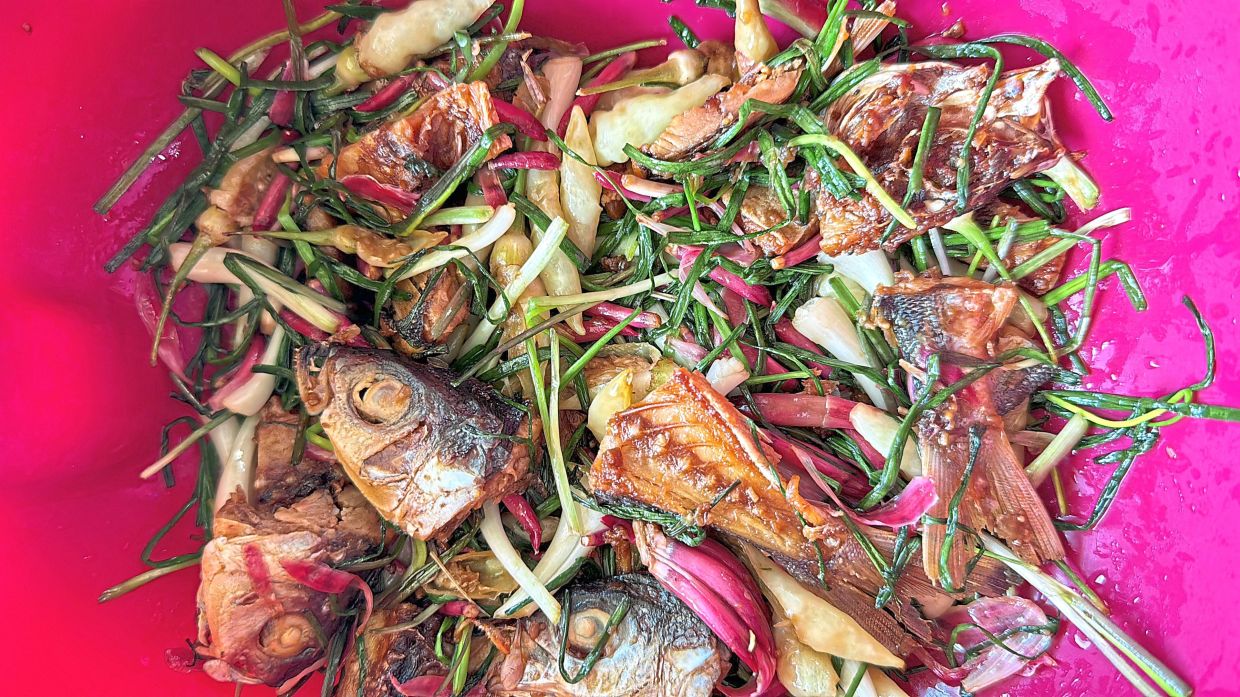 Ikan masin losun is a Sabahan dish that features an East Malaysian chive cooked with salted fish. — PISON JAUJIP